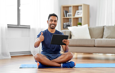 Image showing indian man with tablet computer on exercise mat