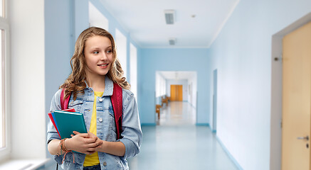 Image showing happy smiling teenage student girl with school bag