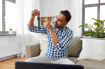 Image showing male blogger recording video review of smart watch