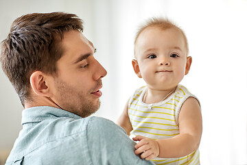 Image showing father with little baby daughter at home