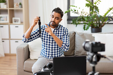 Image showing male blogger with smart watch recording video blog