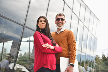 Image showing business people wearing protective mask