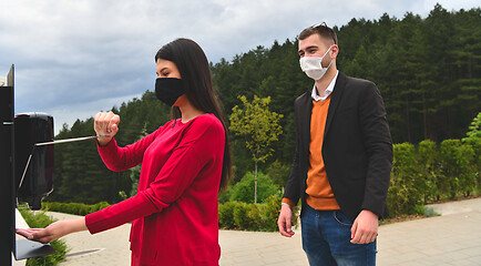 Image showing hands disinfection in restaurant