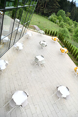 Image showing restaurant tables and chairs at outdoor sitting at restaurant  d