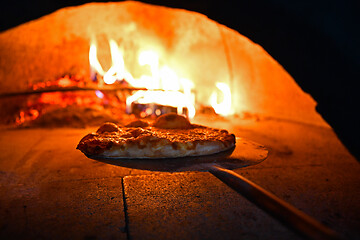 Image showing rustic pizza in wood fired oven