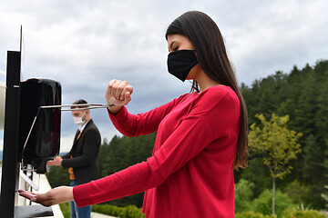 Image showing hands disinfection in restaurant