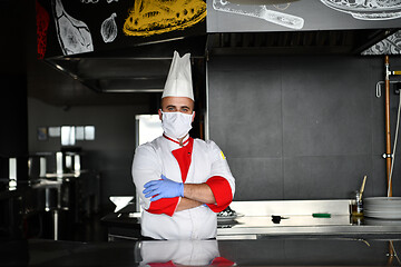 Image showing chef cook wearing face protective medical mask for protection fr