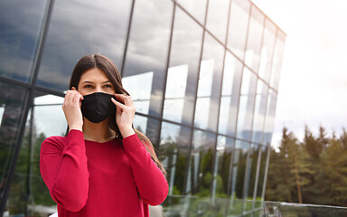 Image showing business woman portrait  with protective mask