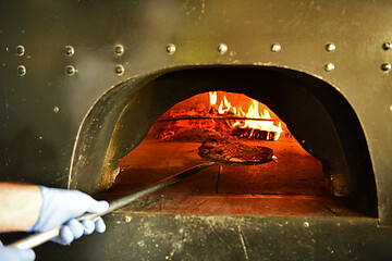 Image showing chef  with protective coronavirus face mask preparing pizza