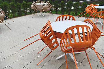 Image showing restaurant tables and chairs at outdoor sitting at restaurant  d