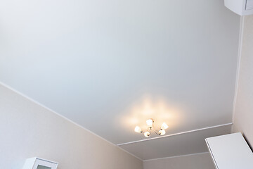 Image showing Classic white matte stretch ceiling in the interior of the bedroom