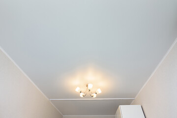 Image showing Classic white matte stretch ceiling in the interior of the room