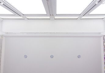 Image showing Contact of a stretch ceiling to a wide stained-glass window