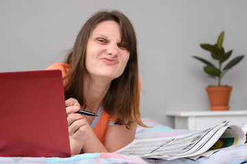 Image showing The girl who is looking for work made a funny face