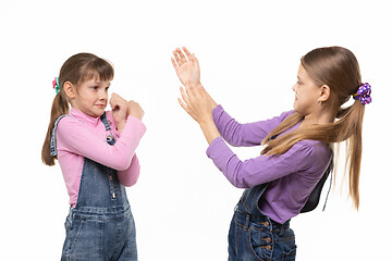 Image showing The sisters got mad at each other and started a fight