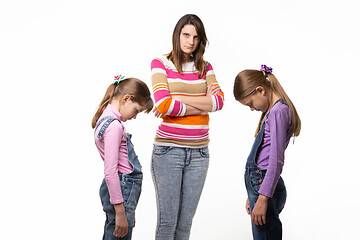 Image showing Mom scolded her daughters, they are ashamed