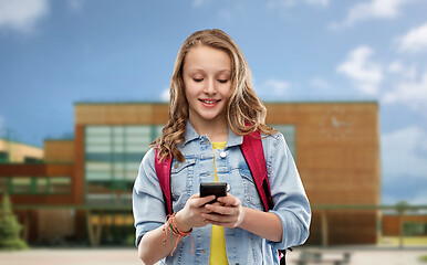 Image showing teen student girl with school bag and smartphone