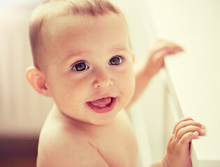 Image showing happy little baby boy or girl at home