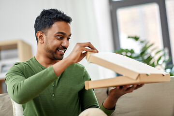 Image showing indian man looking inside of takeaway pizza box