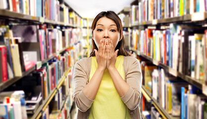 Image showing scared asian woman at library