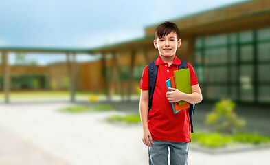 Image showing smiling student boy with books and school bag