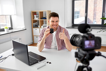 Image showing video blogger with smart speaker shows thumbs up