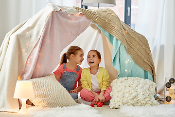 Image showing little girl playing tea party in kids tent at home