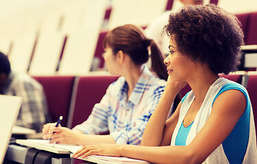 Image showing group of students talking in lecture hall