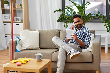 Image showing indian man making to do list after home cleaning