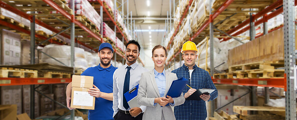 Image showing group of business people and warehouse workers