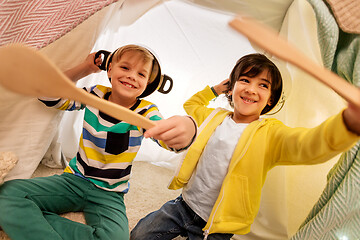 Image showing boys with pots playing in kids tent at home
