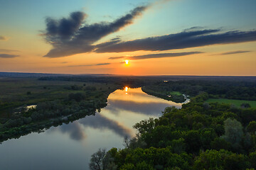 Image showing sunrise or sunset with forest and river