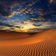 Image showing sand dunes in desert at sunset