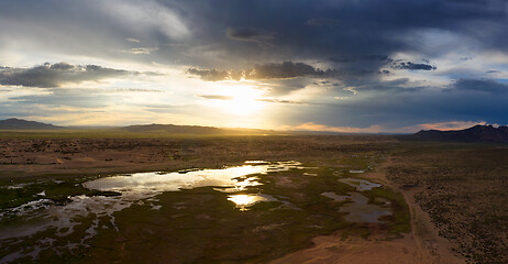 Image showing Sand dunes Bayan Gobi and lake at sunset