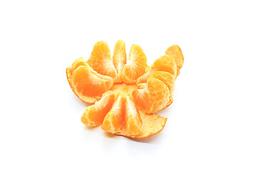 Image showing Tasty tangerine slices isolated on white background