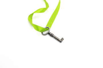 Image showing Vintage silver key with green ribbon