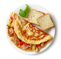 Image showing omelette stuffed with vegetables and ham