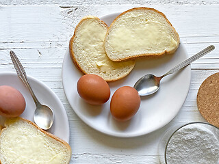 Image showing boiled eggs and bread with butter