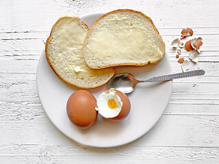 Image showing boiled eggs and bread with butter