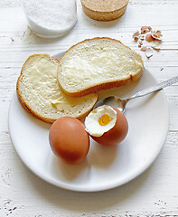 Image showing boiled eggs and bread with butter