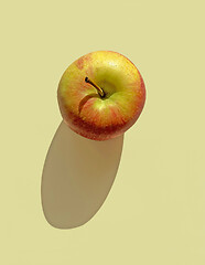 Image showing fresh apple with long shadow