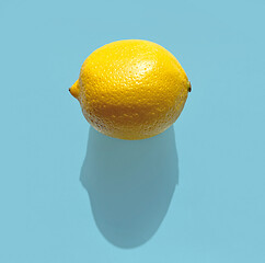 Image showing fresh lemon with long shadow