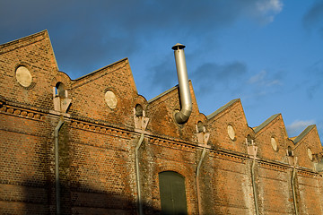 Image showing Factory roof with chimney