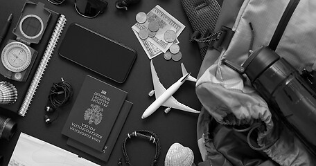 Image showing Travel and Tourist concept. Vacation and travel accessories placed on black background.