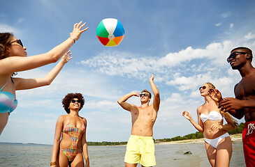 Image showing friends playing with beach ball in summer