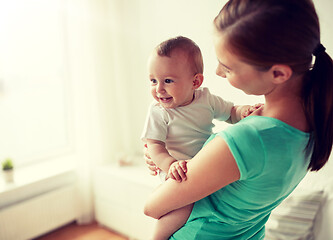 Image showing happy young mother with little baby at home