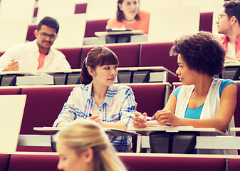 Image showing group of students talking in lecture hall