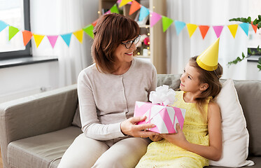 Image showing grandmother giving granddaughter birthday gift