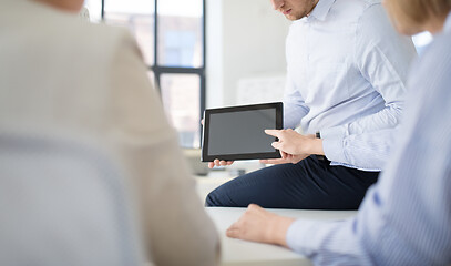 Image showing close up of business team with tablet pc at office