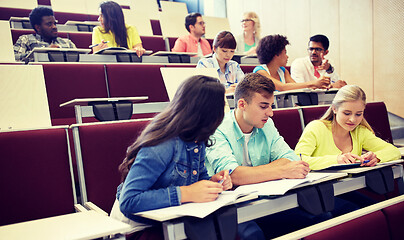 Image showing group of students with notebooks at lecture hall